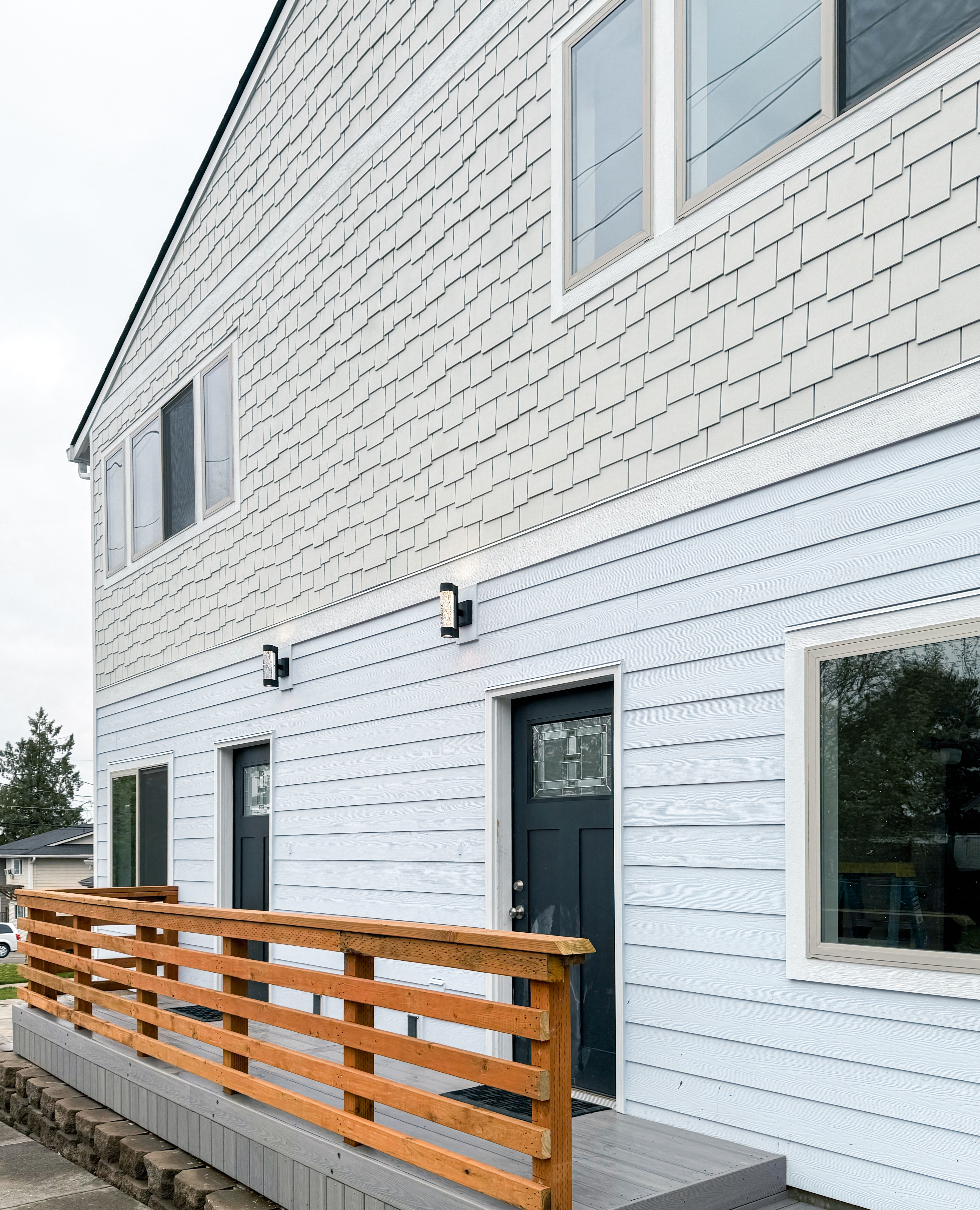 Front entry deck and exterior siding at the duplex.
